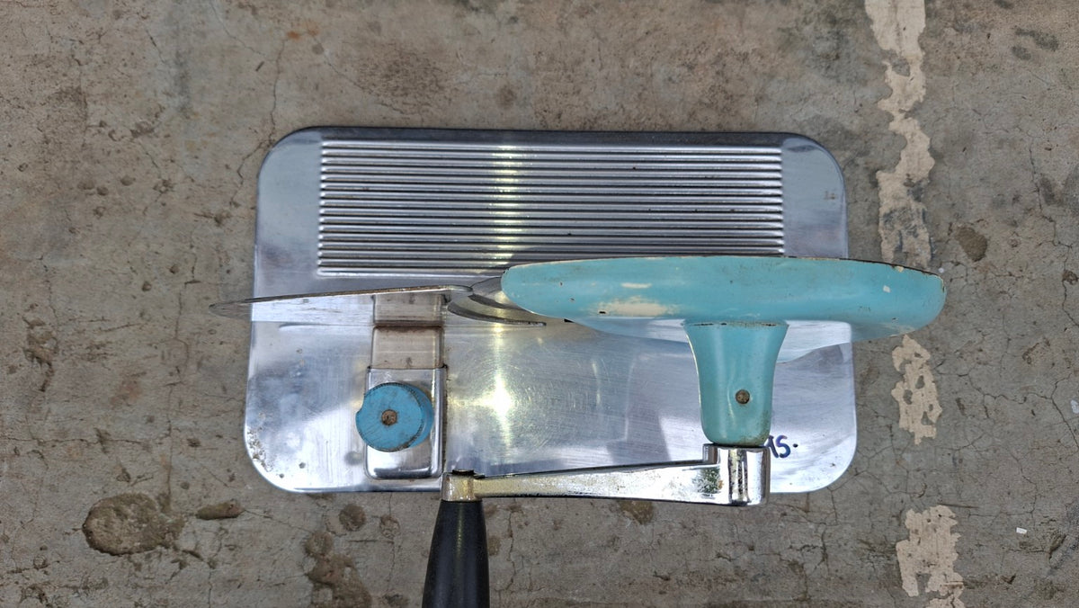 Manual turquoise stainless steel food slicer top view