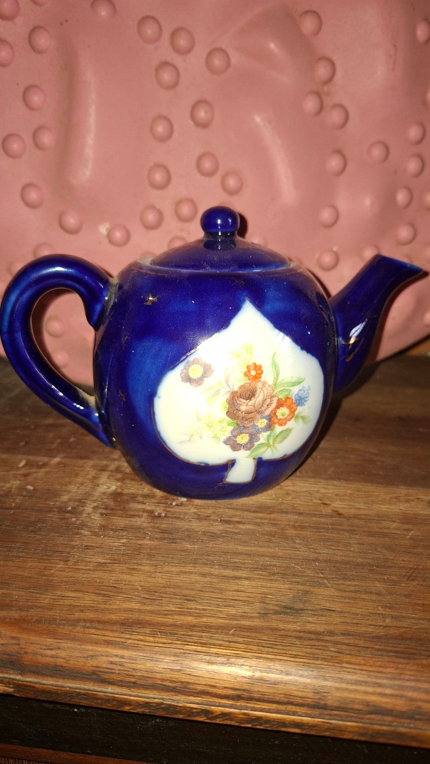 Cobalt blue floral teapot front view