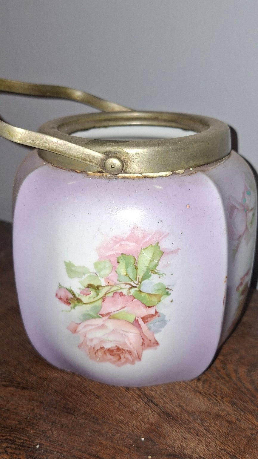 Vintage floral porcelain biscuit jar showing pink rose decoration