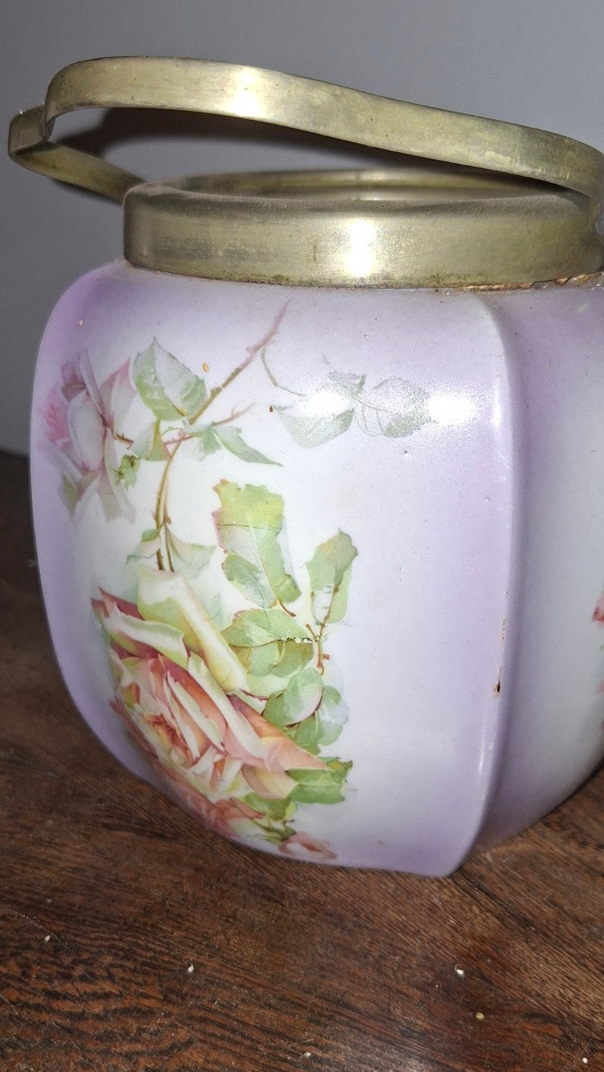 Vintage porcelain biscuit jar with metal handle and lid