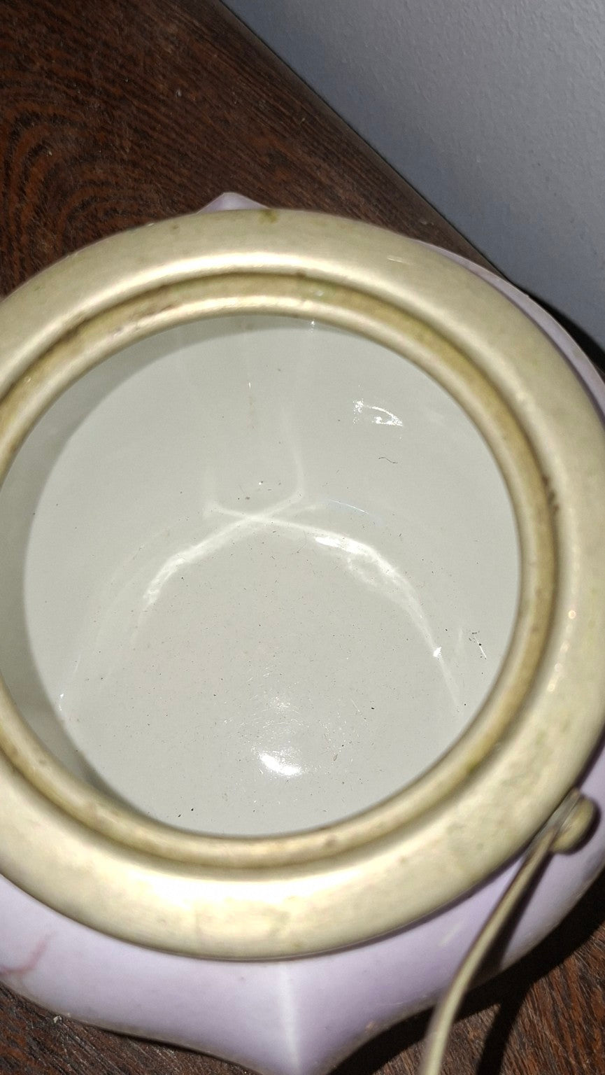Interior and lid detail of vintage floral porcelain biscuit jar